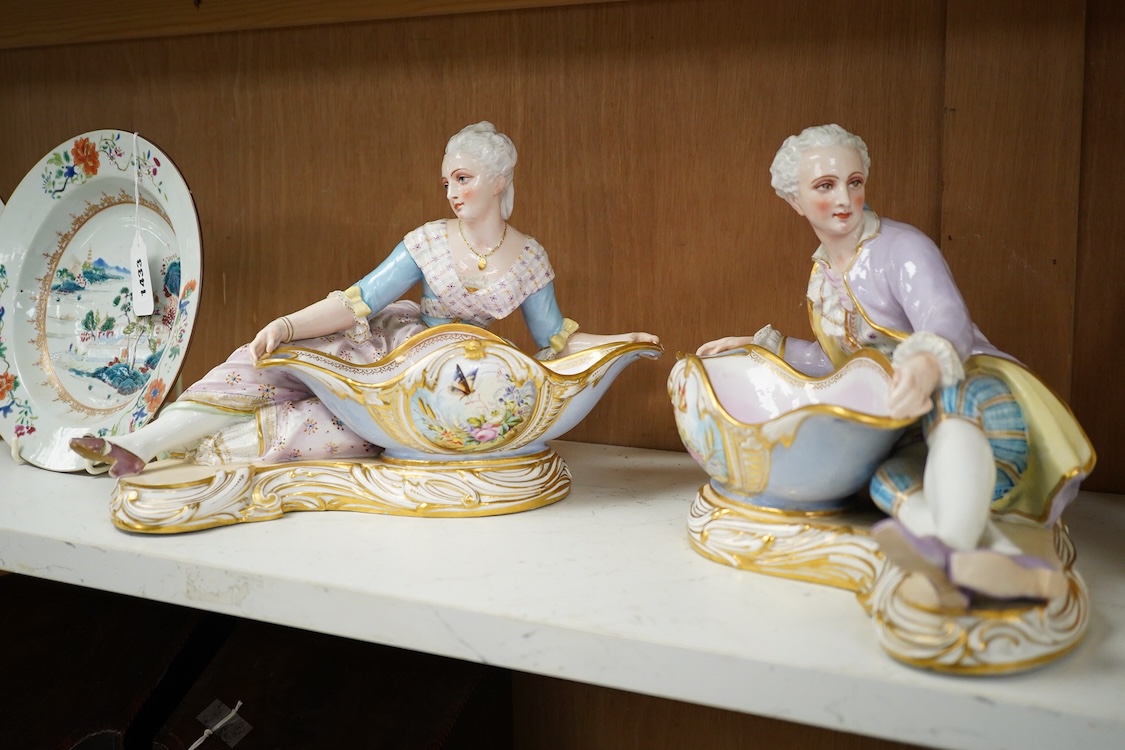 A pair of French porcelain figural sweet meat dishes, late 19th century, 34.5cm